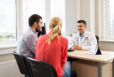 Patient receiving enrollment assistance at FMHC